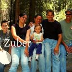 Chad Zuber with his wife Veronica along with three children in outdoor hiking