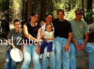 Chad Zuber with his wife Veronica along with three children in outdoor hiking
