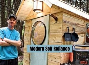 Modern Self Reliance Kevin Leclair relaxing after building mini cubic wood stove.