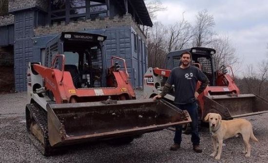 picture of Andrew Camarata with his vehicle Tl12 and his beloved dog